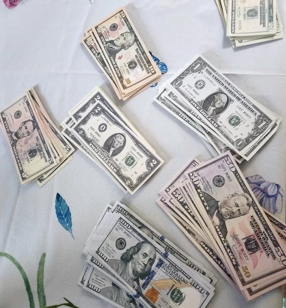 The movie money I got from Amazon was a hit! It's so much fun to play with at a murder mystery party. Check out these fat stacks... of totally fake money. It was a blast to play with!